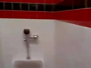 Cashier gives a random guy a public bathroom blowjob