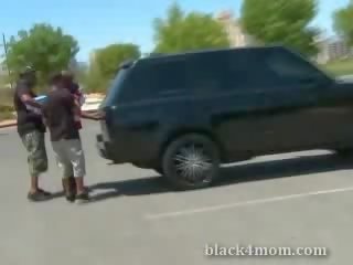 Blonde milf sucks on a ebony boner just after being picked up in a petting lot